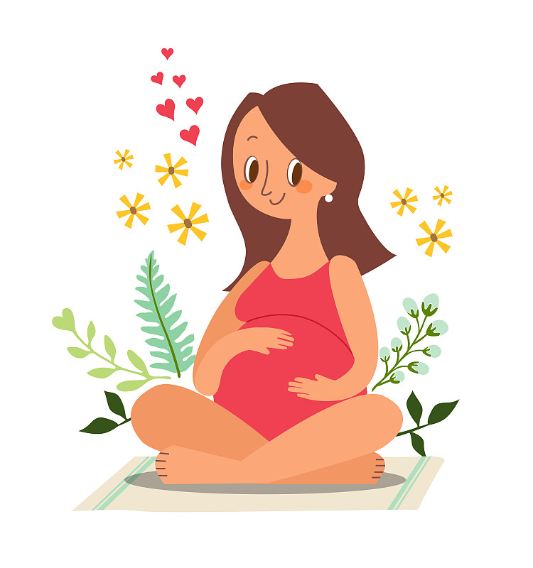 孕妇坐着，抚摸着她的大肚子图片素材