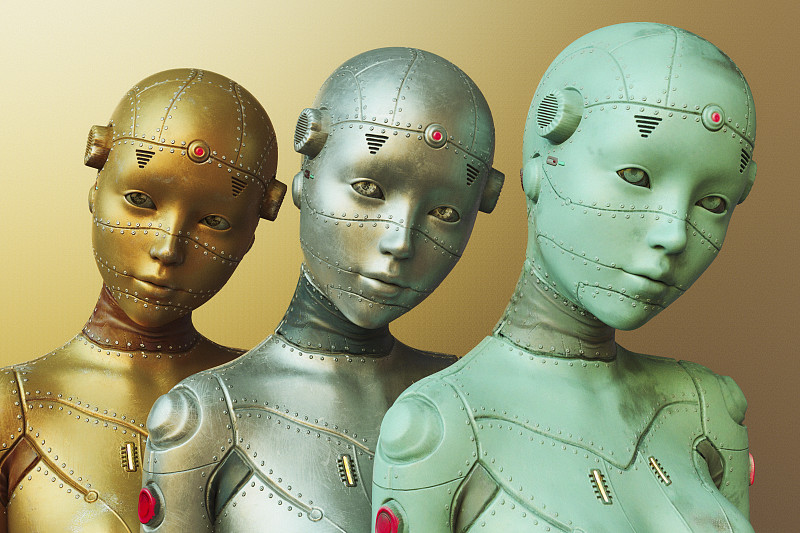 三个女机器人由金色，银色和蓝色的金属制成图片下载