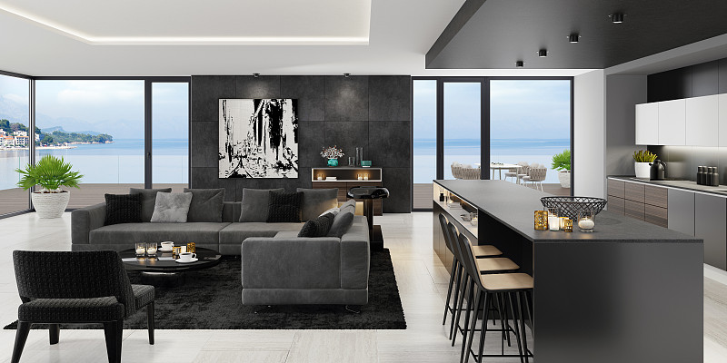 豪华的黑色室内客厅与现代极简主义意大利风格的开放式空间厨房与大长厨房岛。图片下载
