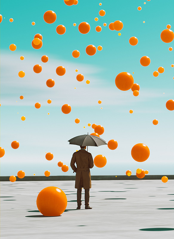 橙色的球从空中以超现实的方式落下的概念图像图片素材