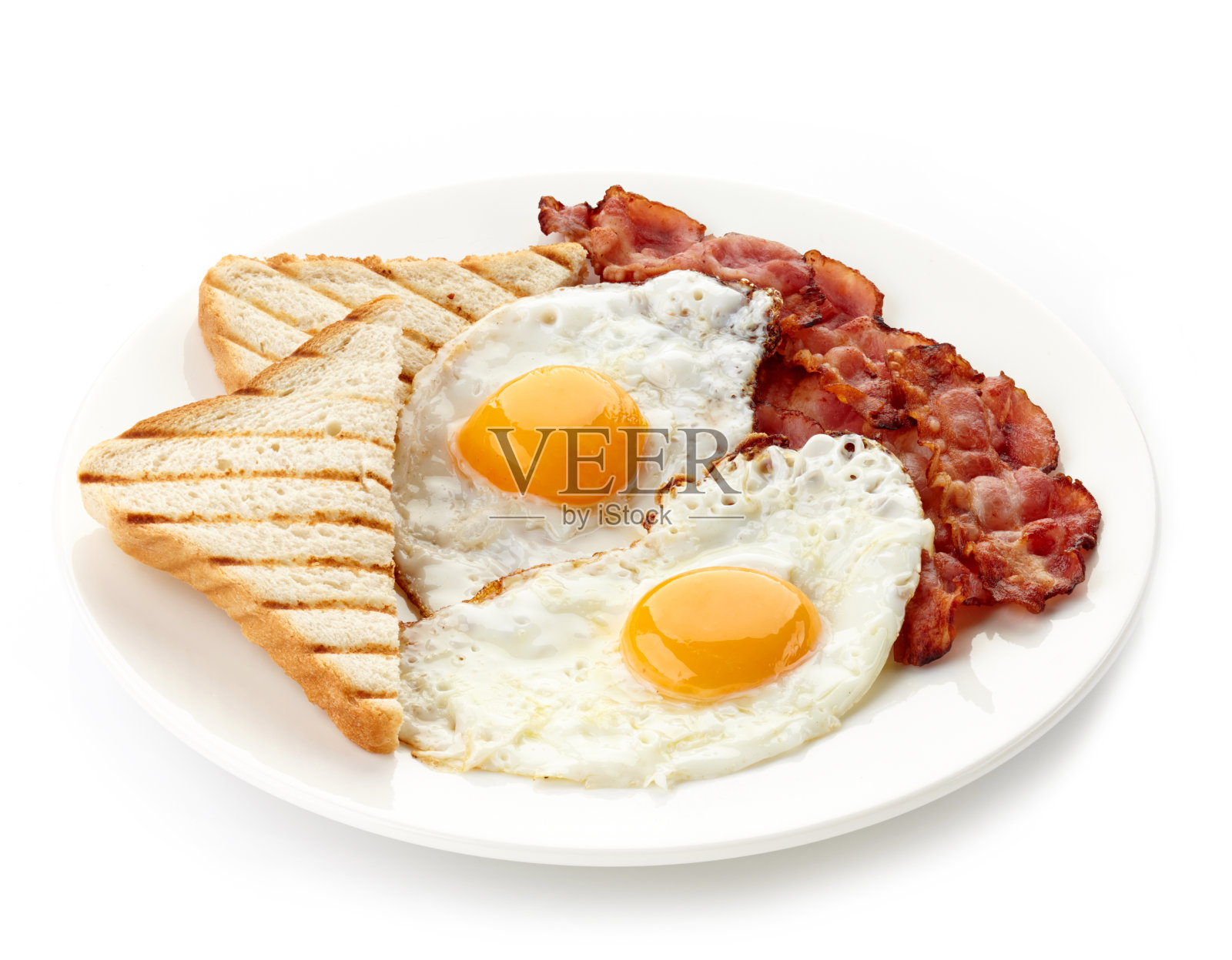 早餐有煎蛋、熏肉和吐司照片摄影图片