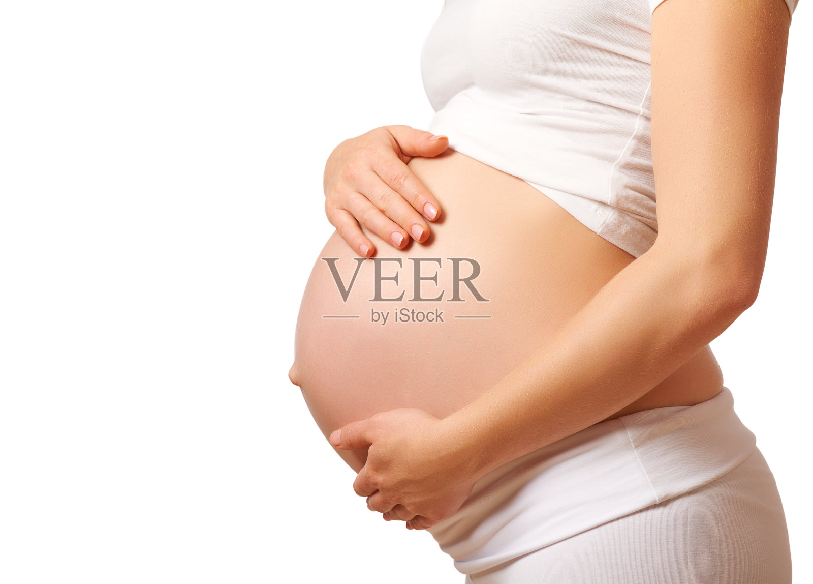 白色背景上孕妇的肚子照片摄影图片