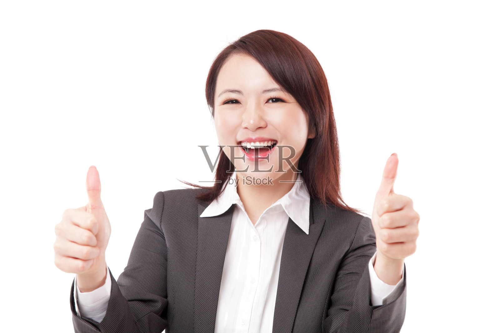 快乐的中国女商人在白色的背景下竖起两个拇指微笑照片摄影图片