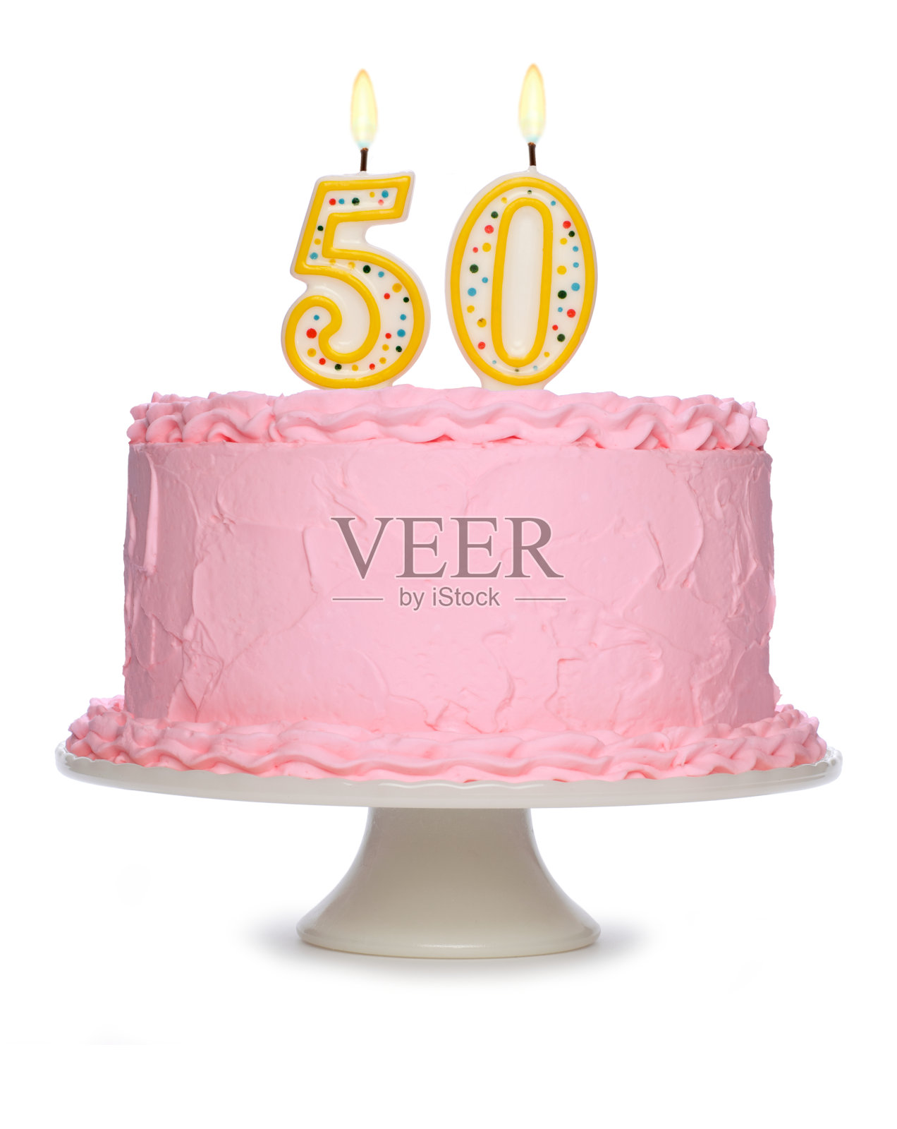 用粉红色糖霜和蜡烛装饰的生日蛋糕照片摄影图片
