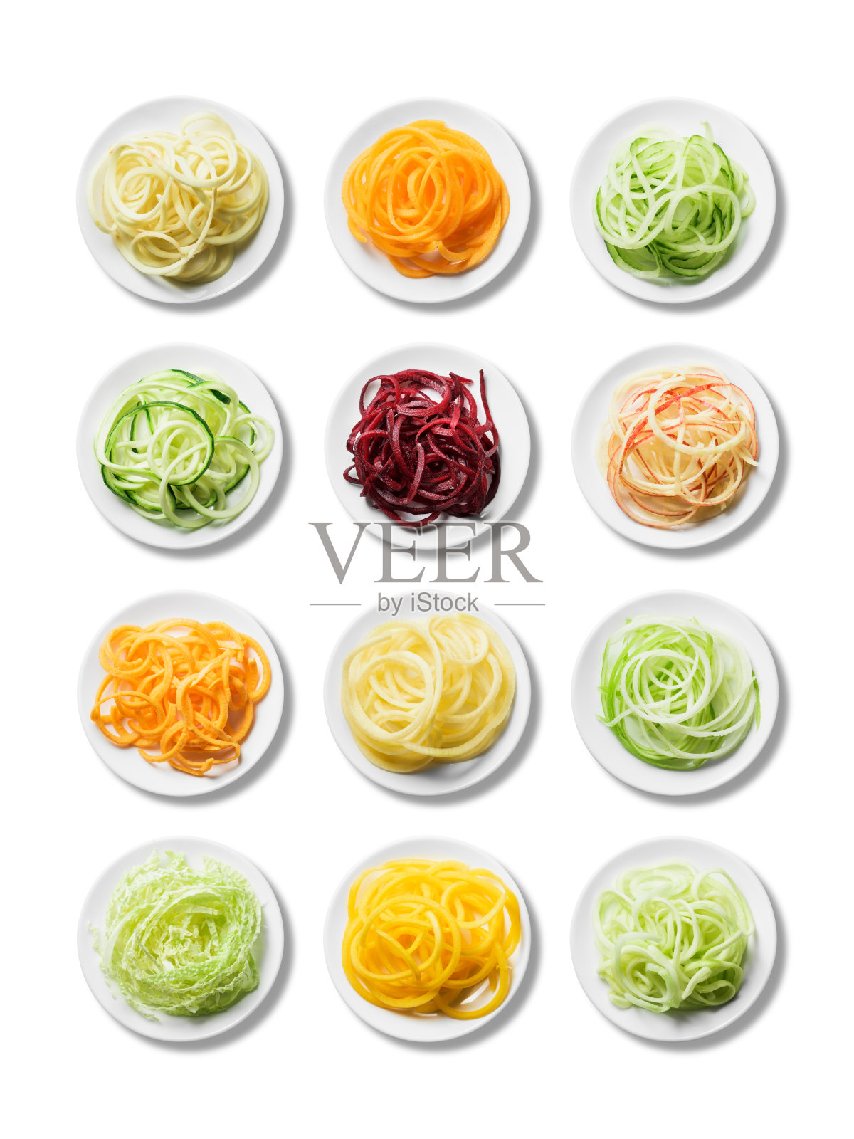 12盘新鲜鲜亮的螺旋形水果和蔬菜照片摄影图片