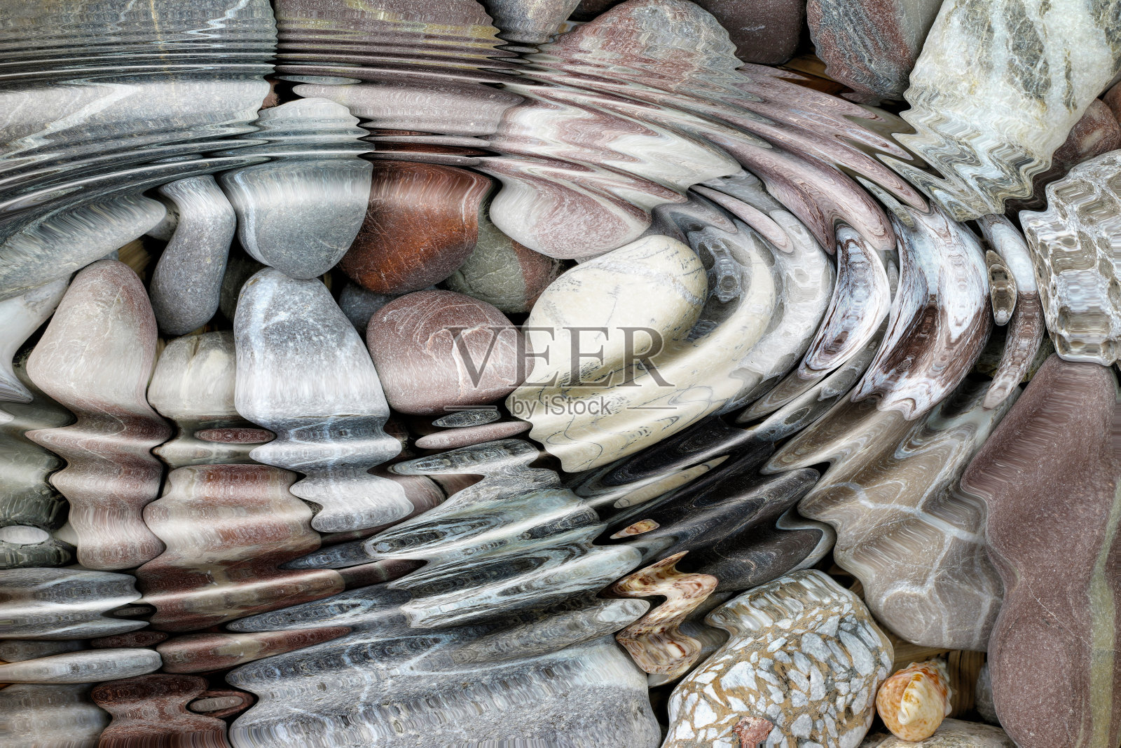 水在鹅卵石上泛起涟漪照片摄影图片