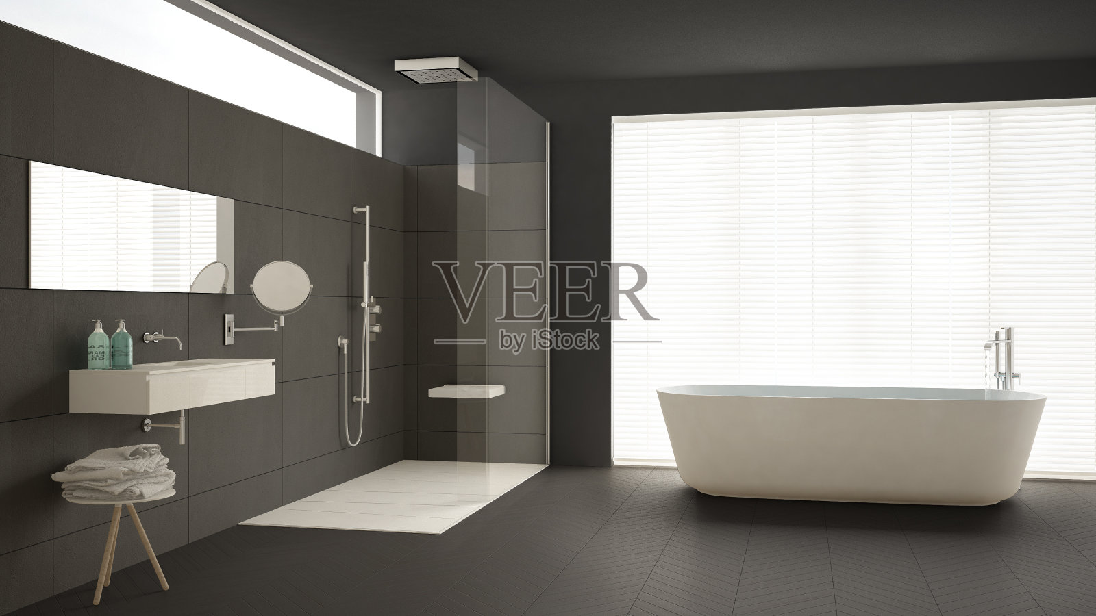 极简主义的浴室配有浴缸和淋浴，拼花地板和大理石瓷砖，经典的灰色室内设计照片摄影图片