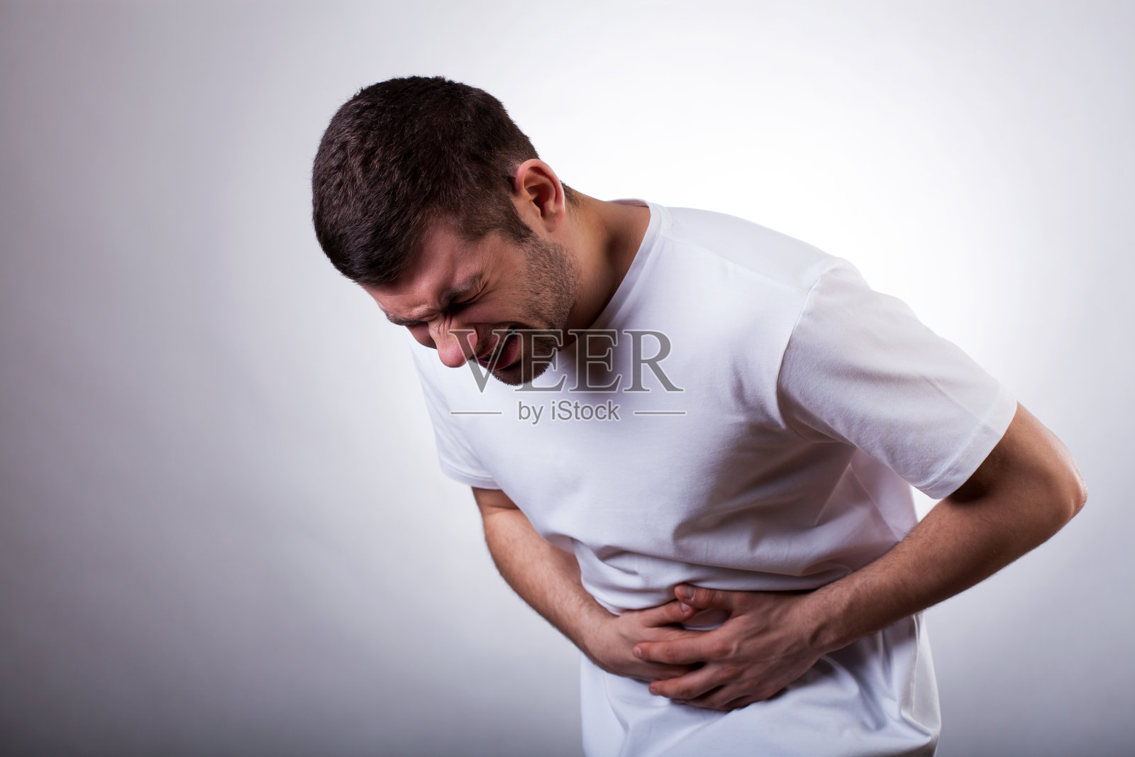 男人胃痛照片摄影图片