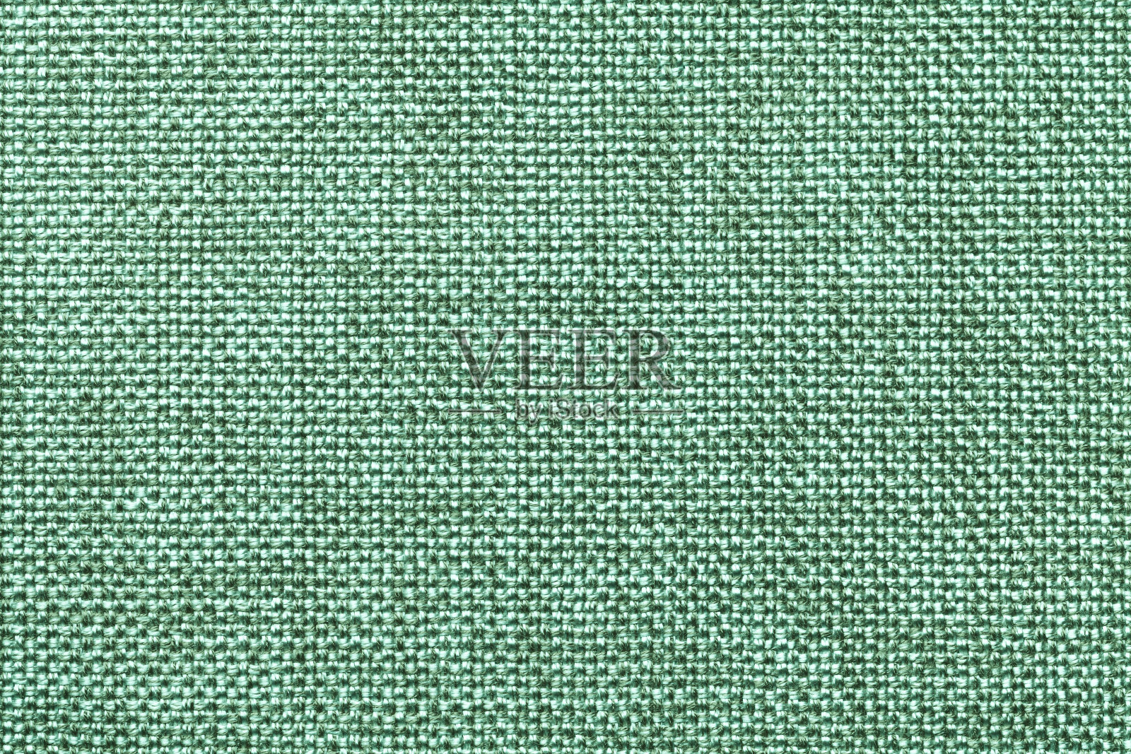 浅绿色纺织品背景特写。织物宏的结构照片摄影图片