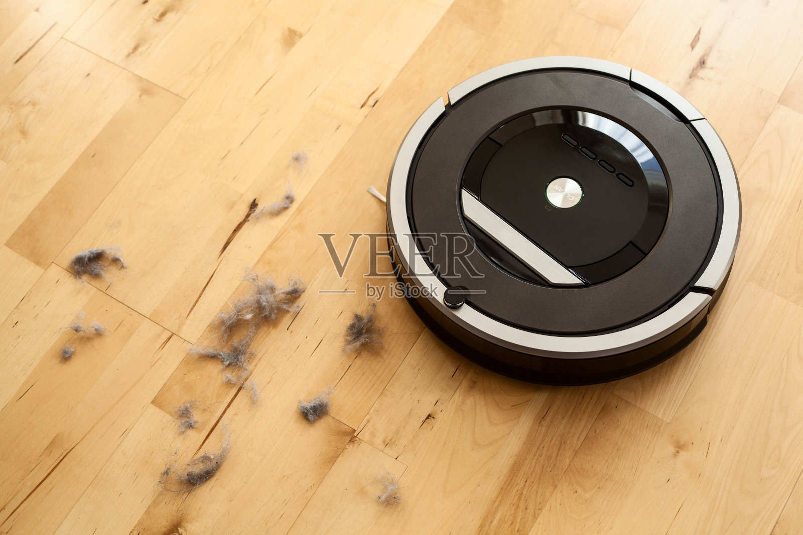 机器人真空吸尘器对强化木地板智能除尘技术照片摄影图片