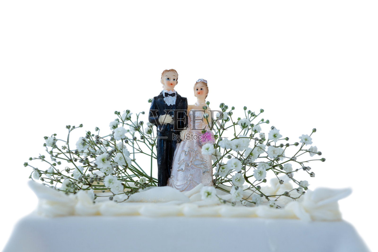 婚礼蛋糕和一对小雕像照片摄影图片
