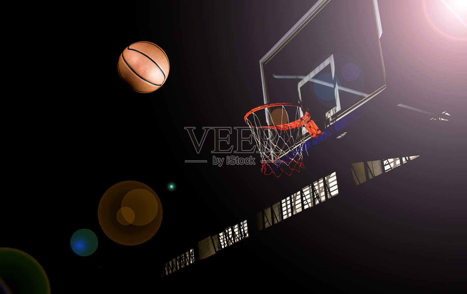 篮球在黑色背景与灯光效果照片摄影图片