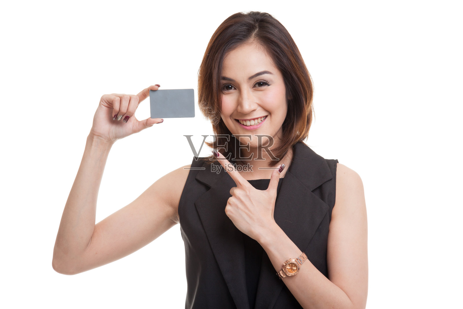 年轻的亚洲女子指着一张空白卡片。照片摄影图片