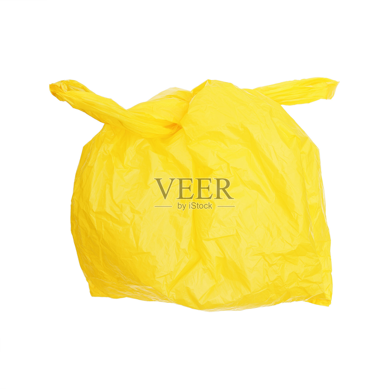 一个系着黄色塑料袋，孤立在白色塑料袋上照片摄影图片