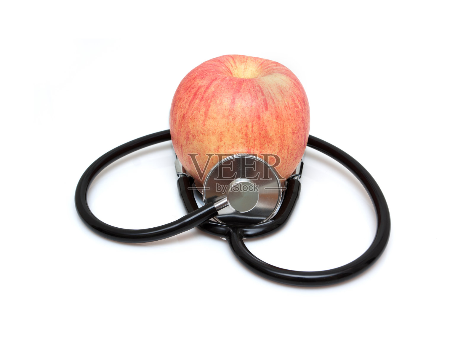 听诊器和苹果(健康饮食)孤立在白色背景上照片摄影图片