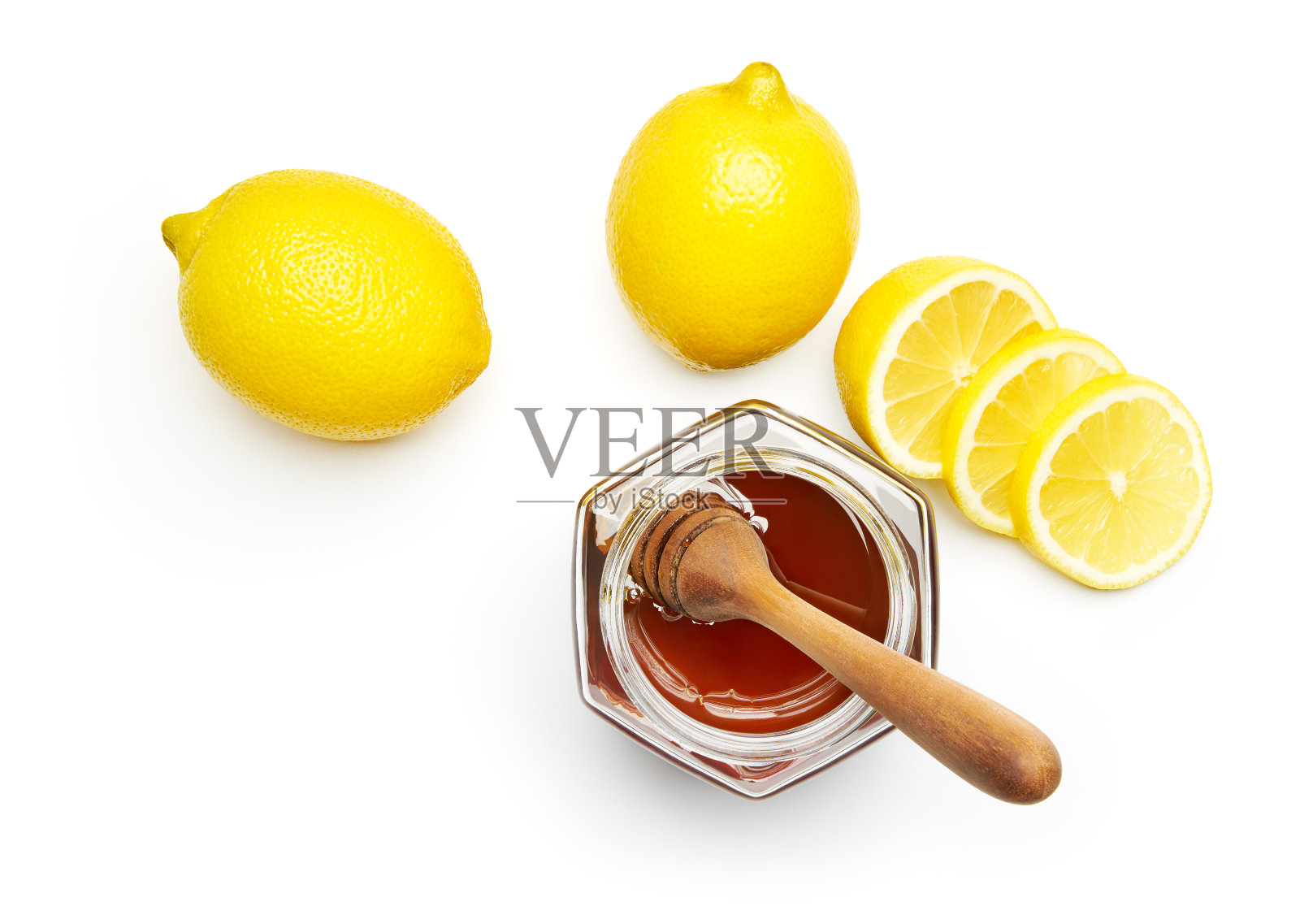 蜂蜜和新鲜柠檬在白色的背景照片摄影图片