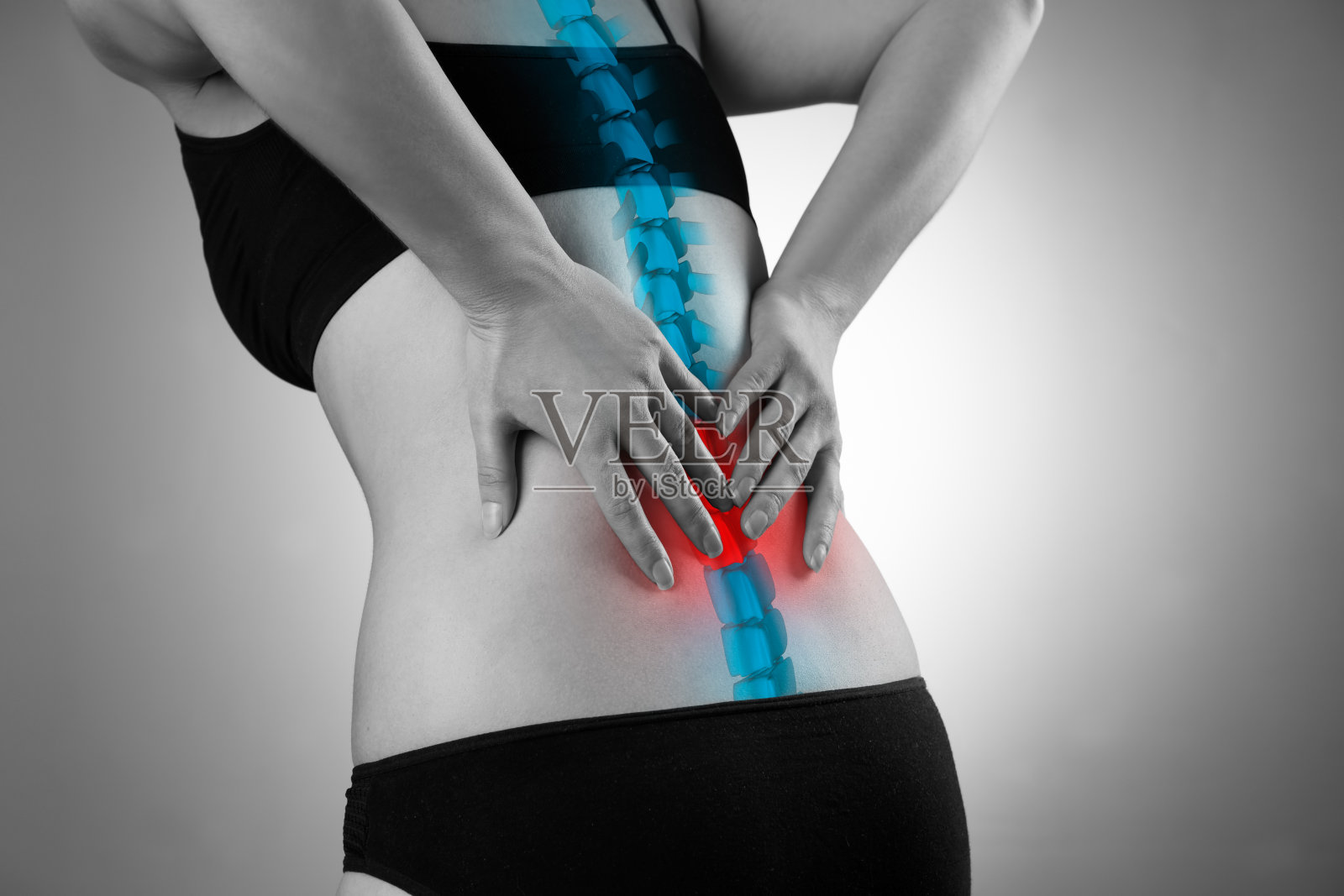 脊椎疼痛，女性背部疼痛，下背部受伤照片摄影图片