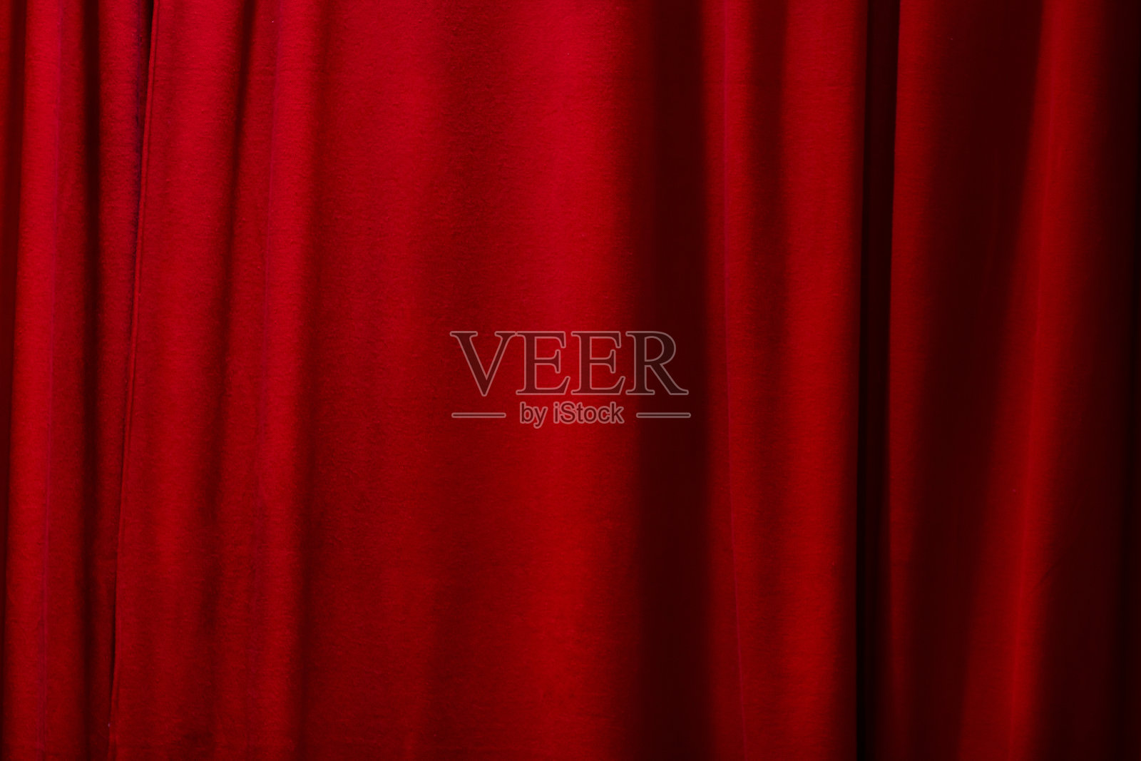 红色的窗帘背景。关闭窗帘。照片摄影图片