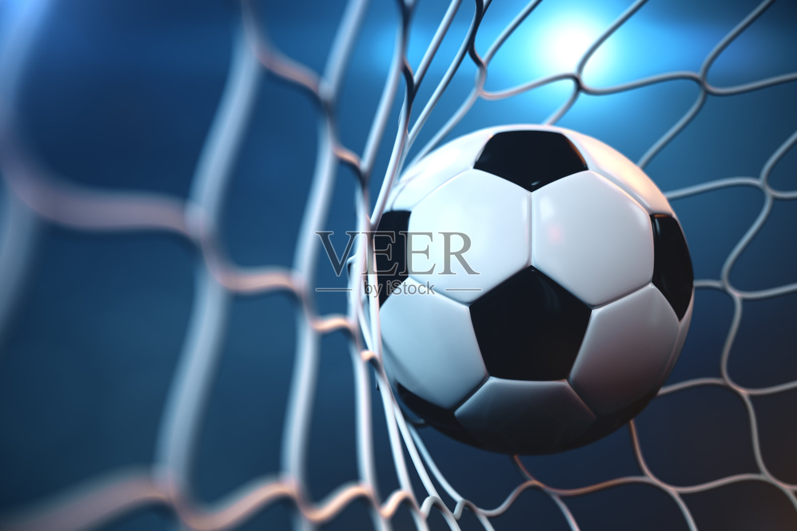 3d渲染足球在目标。足球在网与聚光灯或体育场灯光背景，成功的概念照片摄影图片