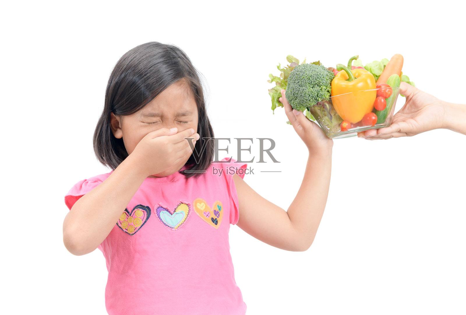 表情厌恶蔬菜的女孩照片摄影图片