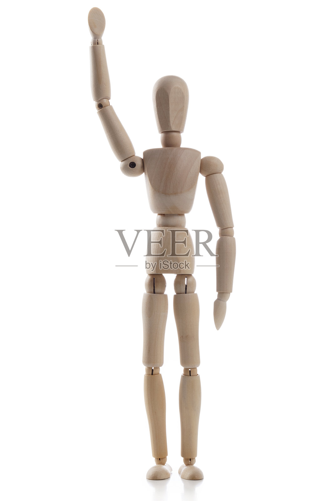 木制人体模型与一只手举起孤立的白色背景照片摄影图片