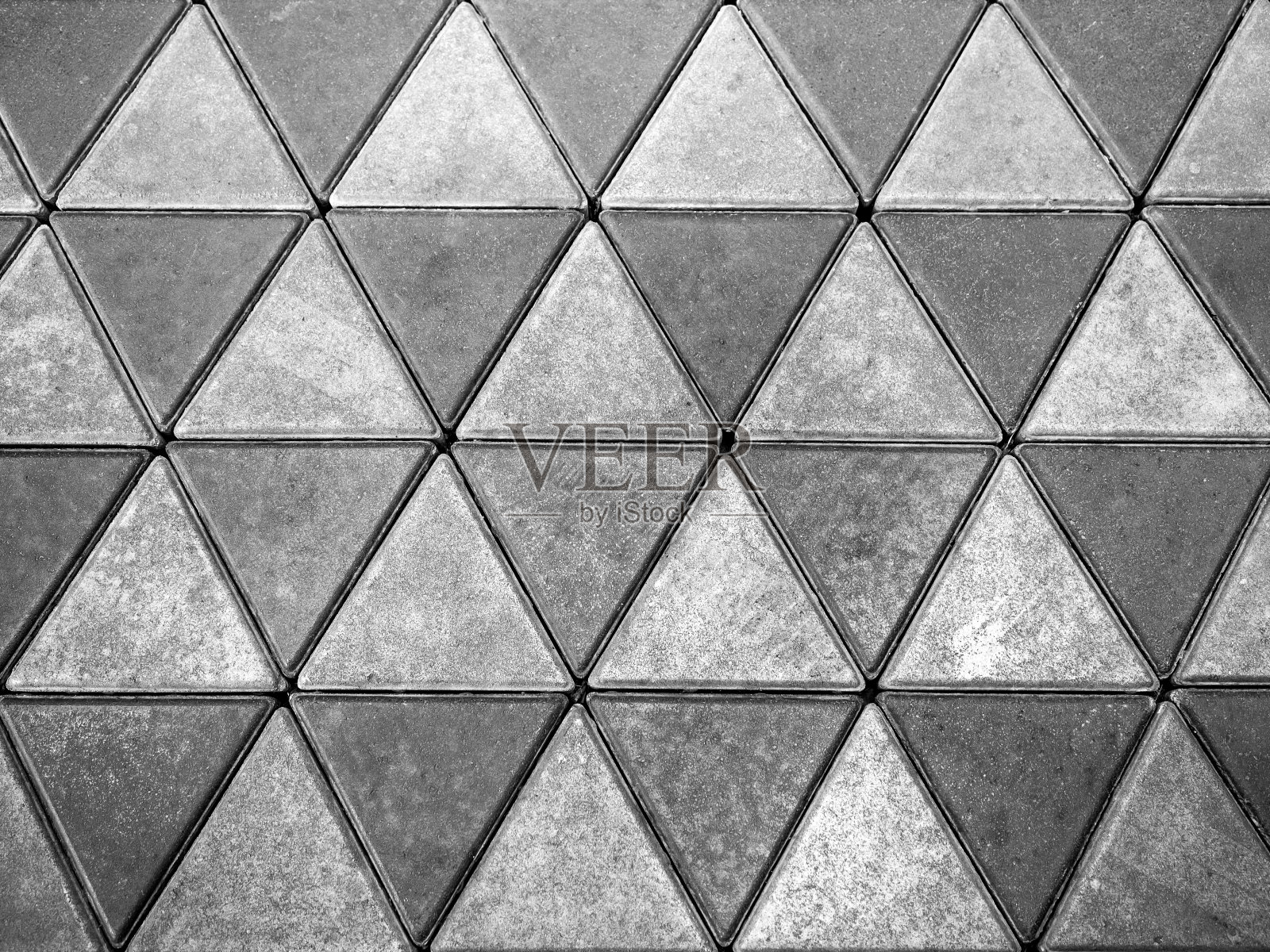 灰色混凝土地板，三角形图案背景。照片摄影图片