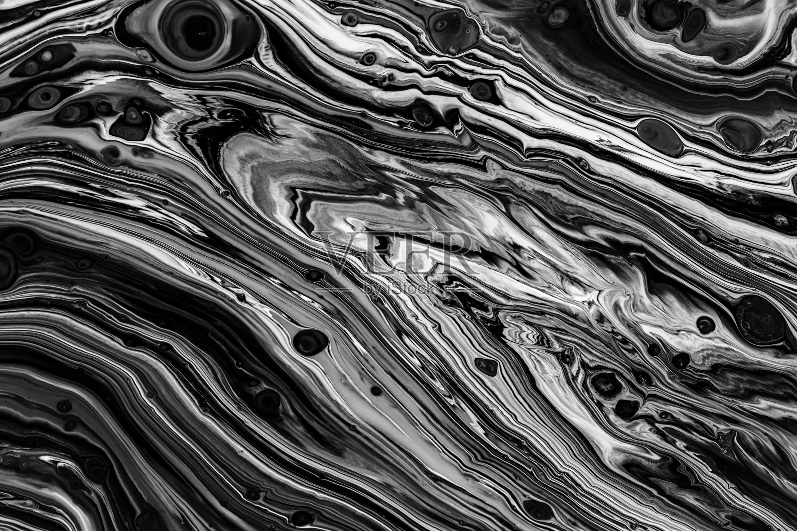 流体艺术纹理。抽象背景与漩涡油漆效果。液体丙烯画与艺术混合颜料。可用于横幅或墙纸。黑色和白色溢出色彩。照片摄影图片