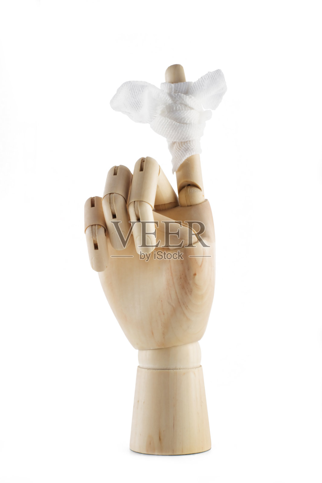 一只带绷带的木头手，手指孤立在白色背景上照片摄影图片