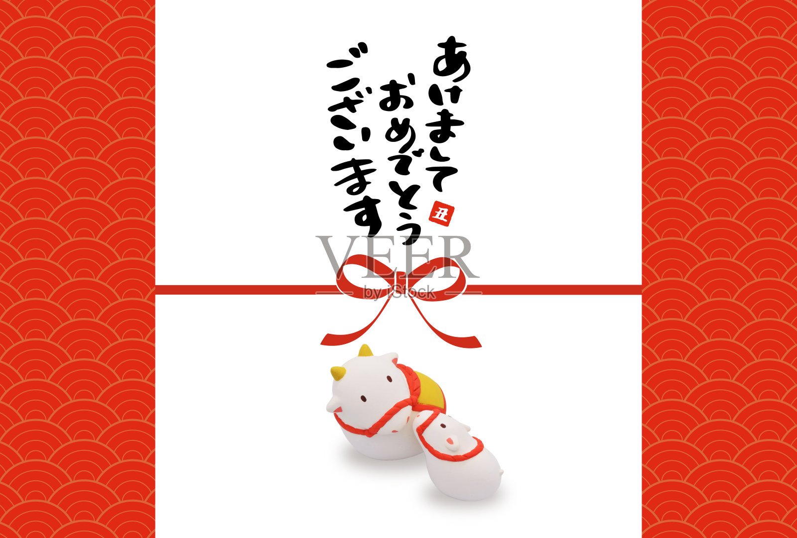 新年贺卡的泥塑日本传统工艺“多雷”。“多雷”是一种粘土制成的钟。照片摄影图片