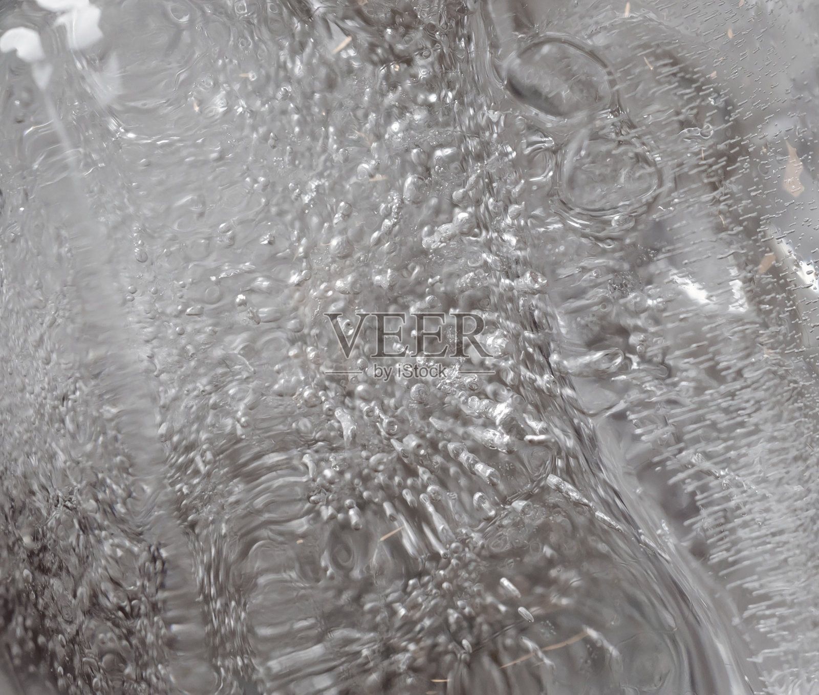 冰晶表面。潮湿，融化或冻结图案纹理。照片摄影图片