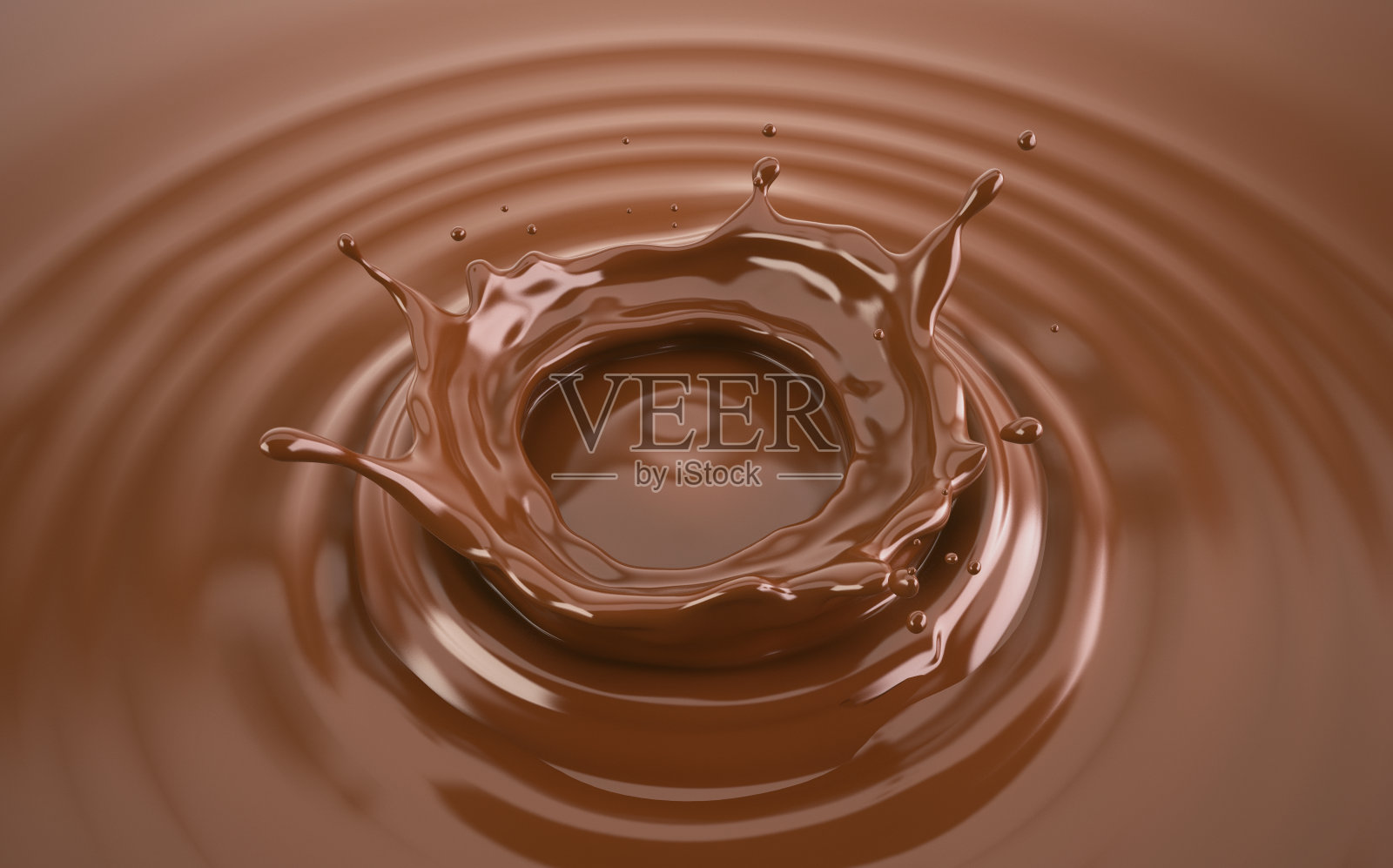 液体巧克力皇冠溅起涟漪。照片摄影图片