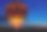 日落时的条纹气球辉光素材图片