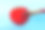 把西红柿刷成鲜红的颜色，在蓝色的背景上，代表坏食物的概念素材图片