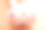 橙色背景上的兰花法国美甲。拥有白色渐变法式指甲的女人手持兰花素材图片