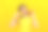 一个美丽的年轻女孩的特写肖像拿着一半的橙子靠近脸孤立在黄色的背景。素材图片