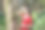 画像美丽的年轻女子在红色的连衣裙站在森林公园在阳光明媚的夏天手挡住太阳的光。户外时尚写真魅力中国时尚淑女。素材图片